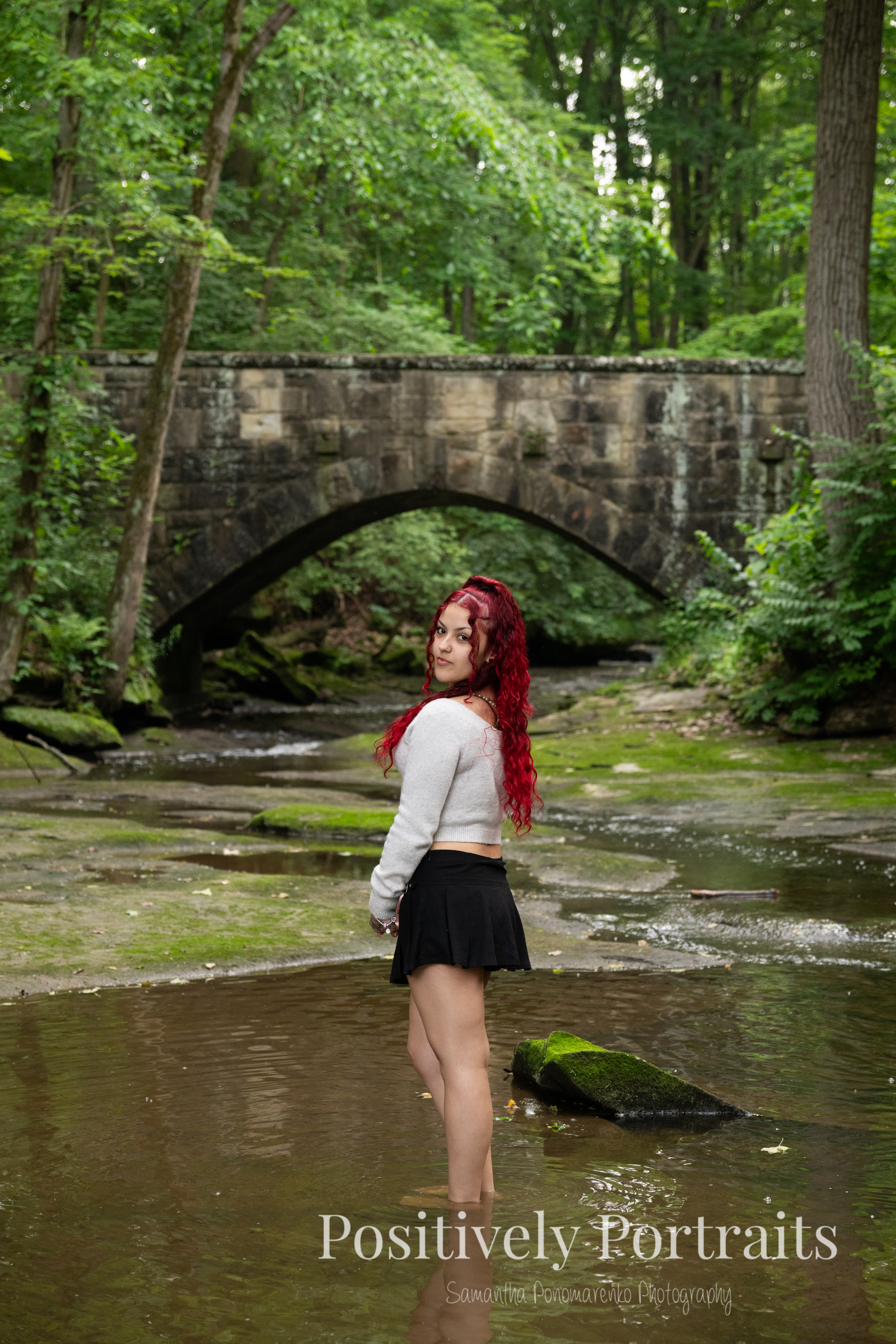 For her second look, Jocelyn changed into a black dress paired with leopard print heels. This outfit brought a bold edge to the session, especially as we explored the stone steps surrounded by greenery.