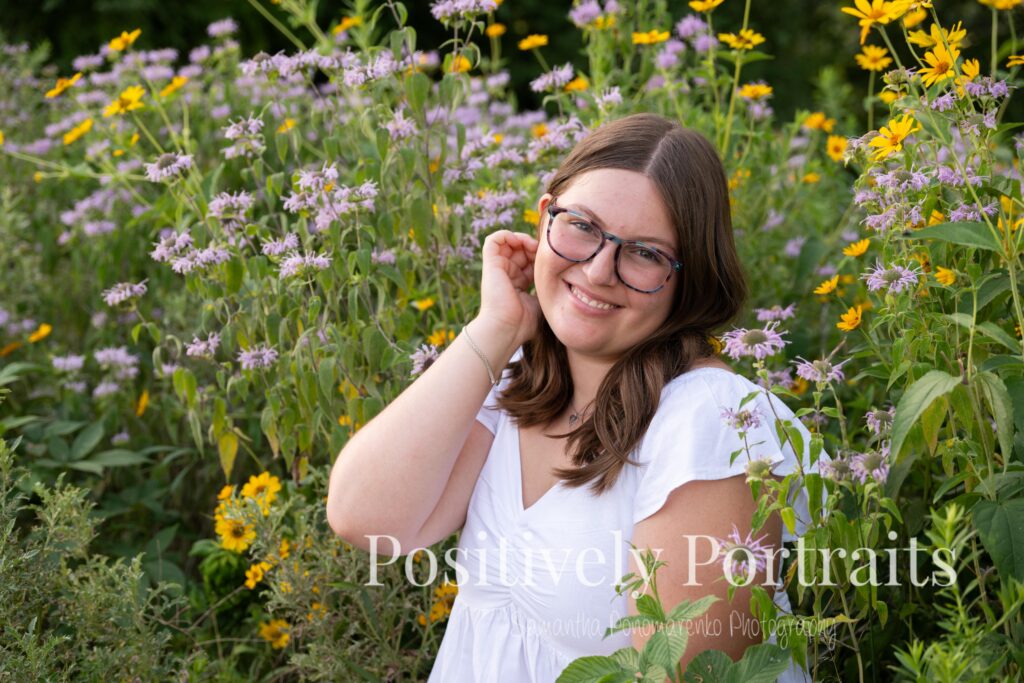 Next, Tabitha kept things classic with a white blouse and blue jeans. This simple, polished look gave us relaxed and natural portraits as we explored the flower patches and scenic trails.